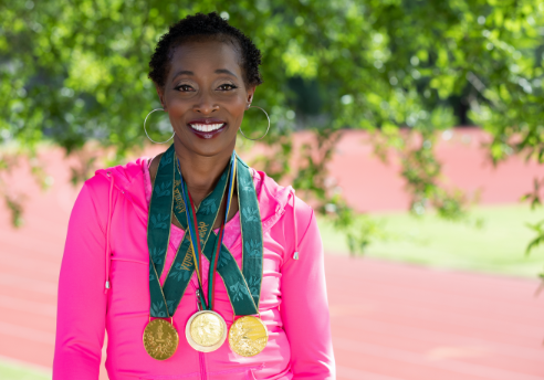 Graves' Disease patient, Gail Devers, with her three gold medals